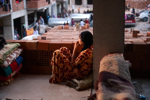 DOHUK, IRAQ - AUGUST 16: Yezidis who fled their home due to the assaults of army groups led by Islamic State (IS), formerly known as ISIL, take shelter in the buildings under construction in Zakho district, a few kilometers from the Iraqi-Turkish border, Dohuk on August 16, 2014. Islamic State fighters captured Iraq's Sinjar and Rabia in the Nineveh province last week after fierce clashes, forcing thousands of Iraqis including Turkmen, Arabs and Yezidis to flee. (Photo by Ahmet Izgi/Anadolu Agency/Getty Images)