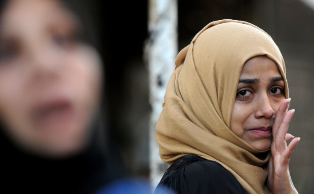 A Pakistani woman weeps as she stands at the site of a bomb blast in Karachi on March 4, 2013 the day following the attack. Pakistan's largest city Karachi shut down on Monday to mourn 45 people killed by a car bomb in a Shiite Muslim neighbourhood, the latest in a series of devastating attacks as Pakistan prepares for elections. AFP PHOTO/Asif HASSAN (Photo credit should read ASIF HASSAN/AFP/Getty Images)