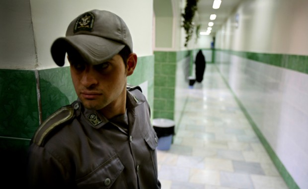 A prison guard stands along a corridor in Tehran's Evin prison June 13, 2006. Iranian police detained 70 people at a demonstration in favour of women's rights, the judiciary said on Tuesday, adding it was ready to review reports that the police had beaten some demonstrators. - RTXOQWJ
